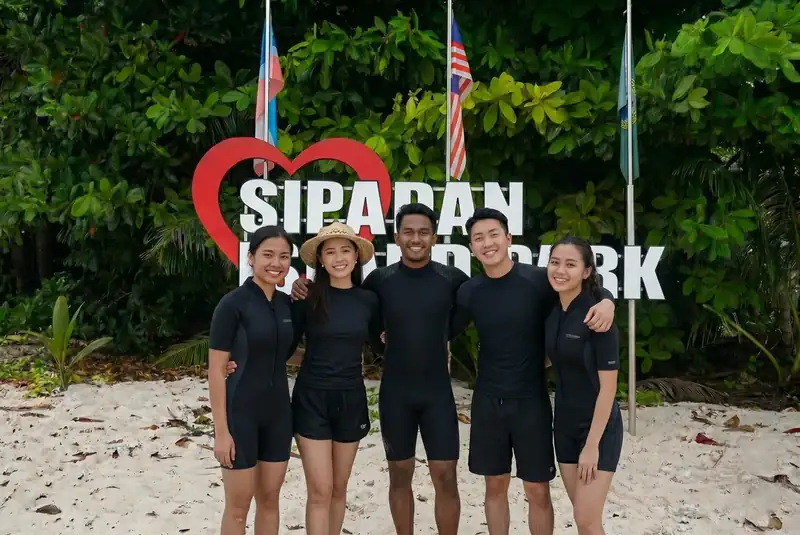 Sipadan Island park sign at Malaysia's most famous dive site, accessible from Semporna