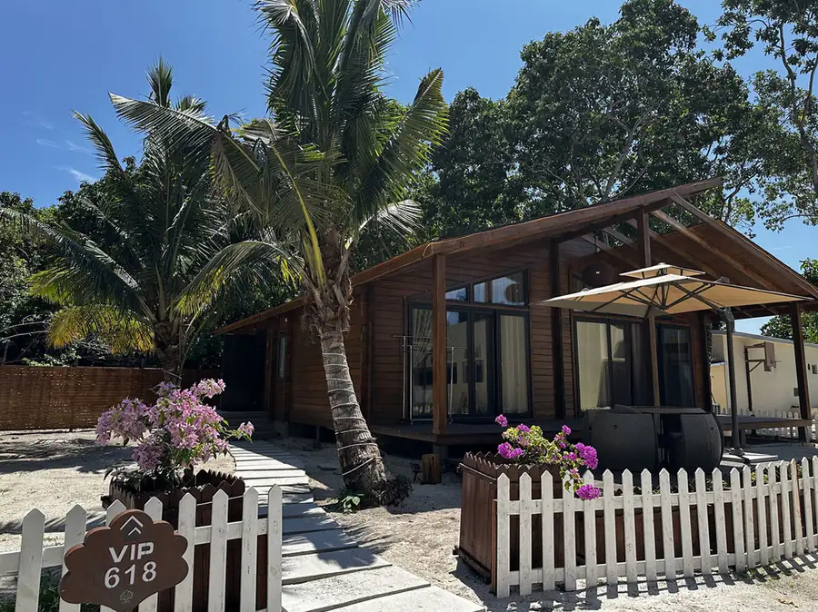 A VIP garden chalet in a traditional Sabah style featuring wood-paneled walls and a sloped timber roof at Doris Mataking Resort